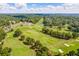 Expansive golf course view with lush fairways, mature trees, and a distant clubhouse at 250 Chason Wood Way, Roswell, GA 30076