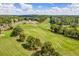 Scenic aerial shot of a meticulously kept golf course winding through a residential community at 250 Chason Wood Way, Roswell, GA 30076