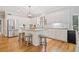 Bright kitchen with white cabinets, stainless steel appliances, and granite countertops at 250 Chason Wood Way, Roswell, GA 30076