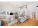 Open living room with hardwood floors, vaulted ceilings, and custom built-ins at 250 Chason Wood Way, Roswell, GA 30076