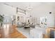Open-concept living room with hardwood floors, a fireplace and a view of the second floor landing at 250 Chason Wood Way, Roswell, GA 30076