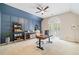 Home office with a modern ceiling fan and wainscoting at 250 Chason Wood Way, Roswell, GA 30076