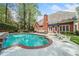 Exterior: Enjoy the in-ground pool with brick trim and a lounging area at 250 Chason Wood Way, Roswell, GA 30076