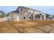 Large backyard with a two-story brick house at 520 Dulles Dr, Mcdonough, GA 30253