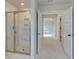 Stylish bathroom featuring a tiled shower with glass door and modern fixtures at 520 Dulles Dr, Mcdonough, GA 30253