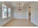 Dining room with elegant coffered ceiling, wainscoting and large window for natural light at 520 Dulles Dr, Mcdonough, GA 30253