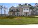 Beautiful two-story home boasting a brick facade and meticulously maintained front lawn at 520 Dulles Dr, Mcdonough, GA 30253