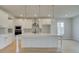 Stylish kitchen features white cabinets, stainless steel appliances, and a spacious center island at 520 Dulles Dr, Mcdonough, GA 30253