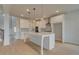 Bright, open kitchen with white cabinets, a large island, and modern pendant lighting at 520 Dulles Dr, Mcdonough, GA 30253