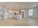 Open-concept kitchen with a large island, white cabinetry, and modern appliances, open to living area at 520 Dulles Dr, Mcdonough, GA 30253