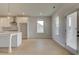 Bright kitchen and breakfast area featuring white cabinets, and stainless steel appliances at 520 Dulles Dr, Mcdonough, GA 30253