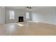 Bright living room with a fireplace, ceiling fan, and hardwood floors at 520 Dulles Dr, Mcdonough, GA 30253