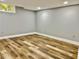 Spacious basement with wood-look floors, neutral paint, and recessed lighting at 1230 Sunderland Ne Ct, Brookhaven, GA 30319