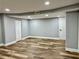 Spacious basement featuring vinyl plank flooring, recessed lighting and ample room for recreation and storage at 1230 Sunderland Ne Ct, Brookhaven, GA 30319