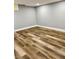Spacious basement with neutral paint and wood-look floors at 1230 Sunderland Ne Ct, Brookhaven, GA 30319