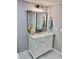 Modern bathroom with a marble countertop vanity and framed mirror at 1230 Sunderland Ne Ct, Brookhaven, GA 30319