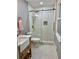 Updated bathroom with stylish vanity, tiled shower with glass door, and marble flooring at 1230 Sunderland Ne Ct, Brookhaven, GA 30319