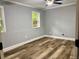 Bedroom with wood-look floors and neutral paint at 1230 Sunderland Ne Ct, Brookhaven, GA 30319