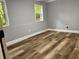 Bedroom with wood-look floors and neutral paint at 1230 Sunderland Ne Ct, Brookhaven, GA 30319