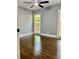 Cozy bedroom features hardwood floors, neutral paint, and ample natural light at 1230 Sunderland Ne Ct, Brookhaven, GA 30319