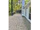 Spacious wooden deck with white painted brick chimney and a view of the surrounding greenery at 1230 Sunderland Ne Ct, Brookhaven, GA 30319
