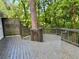 Well-maintained deck with a custom design featuring a built-in tree feature, perfect for outdoor enjoyment at 1230 Sunderland Ne Ct, Brookhaven, GA 30319