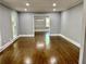 Bright dining room featuring hardwood floors, classic trim, and a modern light fixture at 1230 Sunderland Ne Ct, Brookhaven, GA 30319