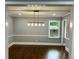 Bright dining room with hardwood floors, recessed lighting, and modern chandelier fixture at 1230 Sunderland Ne Ct, Brookhaven, GA 30319