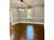 Dining room with hardwood flooring, chair rail, and ample natural light from the window at 1230 Sunderland Ne Ct, Brookhaven, GA 30319