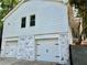Home with an attached garage and white siding at 1230 Sunderland Ne Ct, Brookhaven, GA 30319