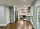 Modern kitchen with stainless steel appliances, gray cabinets, and hardwood flooring at 1230 Sunderland Ne Ct, Brookhaven, GA 30319