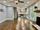 Open concept living room and kitchen with hardwood floors, fireplace, and modern design at 1230 Sunderland Ne Ct, Brookhaven, GA 30319