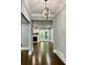 Open-concept living space with hardwood floors and a fireplace at 1230 Sunderland Ne Ct, Brookhaven, GA 30319