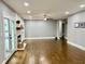 Bright and spacious living room with hardwood floors, a fireplace, and a walkout to the outdoors at 1230 Sunderland Ne Ct, Brookhaven, GA 30319