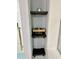 Bathroom shelves are mounted on the wall at 1230 Sunderland Ne Ct, Brookhaven, GA 30319