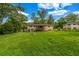 Spacious backyard with an expansive lawn perfect for outdoor activities and entertaining guests at 14300 Veterans Memorial Highway, Villa Rica, GA 30180