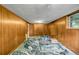 Unfinished basement with paneled walls, abstract floor, and window at 14300 Veterans Memorial Highway, Villa Rica, GA 30180