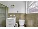 Traditional bathroom with a glass shower, single sink vanity, and tiled walls at 14300 Veterans Memorial Highway, Villa Rica, GA 30180