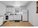 Kitchen with appliances, white cabinets and a window at 14300 Veterans Memorial Highway, Villa Rica, GA 30180