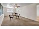 Spacious living room with neutral carpet, ceiling fan and natural light from the window at 14300 Veterans Memorial Highway, Villa Rica, GA 30180