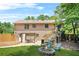 Large backyard with firepit, outdoor seating, and a deck overlooking the property at 150 Victoria Sta, Woodstock, GA 30189