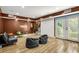Basement with tile floors, bean bag chairs, and a sliding glass door to the outside at 150 Victoria Sta, Woodstock, GA 30189