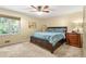 Cozy bedroom with a large window, plush carpet, and comfortable queen size bed at 150 Victoria Sta, Woodstock, GA 30189