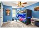 A room with blue walls, carpeted floors, and a custom bunk bed with LED lighting at 150 Victoria Sta, Woodstock, GA 30189