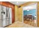 Beautiful kitchen with stainless steel refrigerator, tile floors, and view to dining room at 150 Victoria Sta, Woodstock, GA 30189