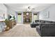 Cozy living room with a stone fireplace, plush carpeting, and abundant natural light creates an inviting atmosphere at 150 Victoria Sta, Woodstock, GA 30189