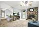 Cozy living room featuring a fireplace, ceiling fan and large windows at 150 Victoria Sta, Woodstock, GA 30189