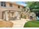 Charming patio with gazebo, dining set, stone grill, and stairs leading to the upper level at 150 Victoria Sta, Woodstock, GA 30189
