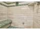 Walk-in shower with white subway tile, mosaic accents, shower bench, and niche at 150 Victoria Sta, Woodstock, GA 30189