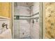 Walk-in shower with white subway tile, bench, niche, and dual shower heads at 150 Victoria Sta, Woodstock, GA 30189